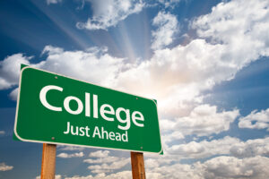 College Just Ahead Green Road Sign with Dramatic Clouds, Sun Rays and Sky.