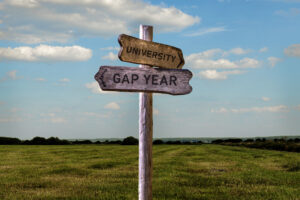 Gap year or university signpost outside.